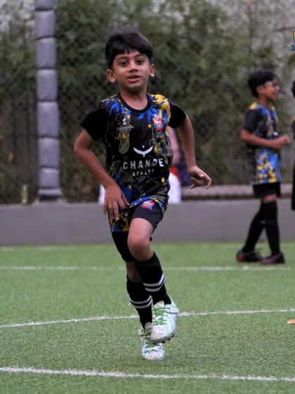 A young player sprinting during a speed drill, building the explosive power needed for the game.