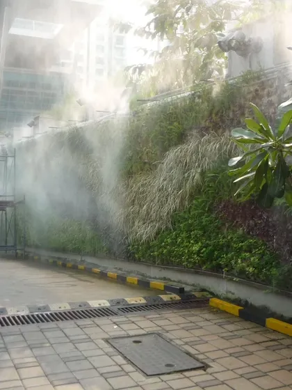 Here is a vertical garden we maintain, with its integrated misting system in action. Proper irrigation is critical for the health of a green wall, and our team ensures these technical systems are always functioning perfectly to keep the foliage dense and vibrant.