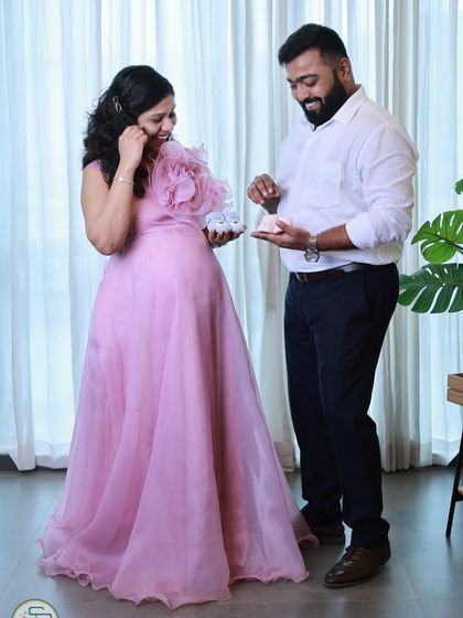 Our lavender organza gown is pure romance. It features a large, handcrafted statement flower on the shoulder and a light, airy skirt that flows beautifully.