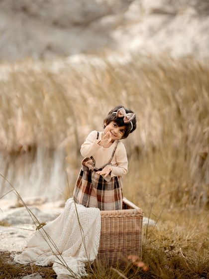 A wider shot showing the beautiful, rustic landscape that serves as the backdrop for this outdoor session.