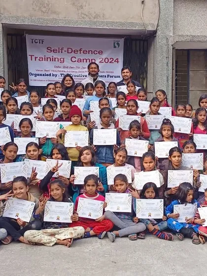 The proud participants of our self-defense training camp holding their completion certificates. We successfully trained this group in partnership with The Creative Thinkers Forum.