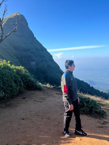 A trekker looking out at the view from the trail. These moments of solitude are precious.