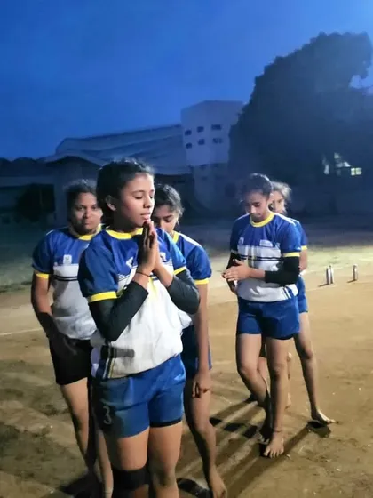 A moment of prayer and focus before the start of a Kabaddi match. Mental preparation is just as important as physical.