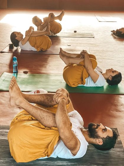 After an active practice, we rest in Apanasana (Knees-to-Chest Pose). This is a moment to release the lower back, calm the nervous system, and integrate the benefits of the practice. We teach the importance of balancing effort with surrender.
