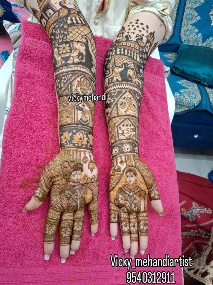 This intricate design showcases bride and groom portraits, surrounded by detailed patterns and traditional motifs like elephants and wedding processions.