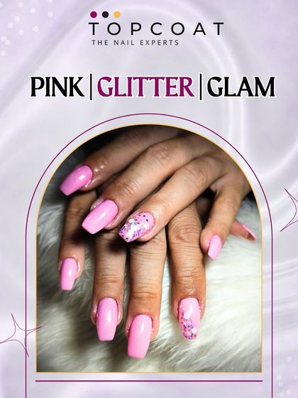 Pink, glitter, and glam. This look features a bright pink polish with a chunky pink glitter accent nail for a fun and glamorous statement.