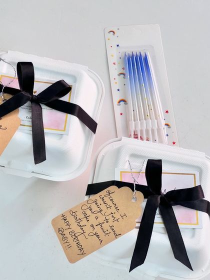 Various examples of my gift wrapping, showing different combinations of ribbons, flowers, and bags to suit any occasion.