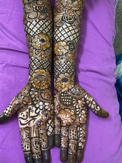 A full bridal design with a mix of floral and net patterns.