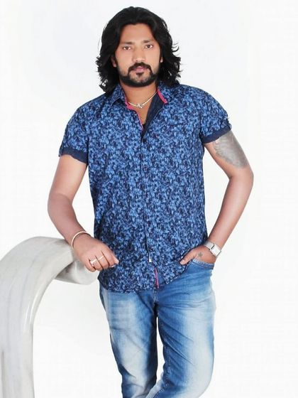 A professional shot from a photoshoot. I take my art seriously, and that includes presenting myself as a dedicated artist you can trust with your story.