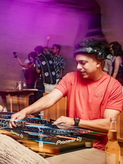 A motion-blur shot capturing the dynamic energy of DJing at Bastian.