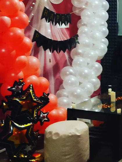 A glimpse of another one of our decoration themes, showing how we can use different color balloons and banners to completely change the look of the space.