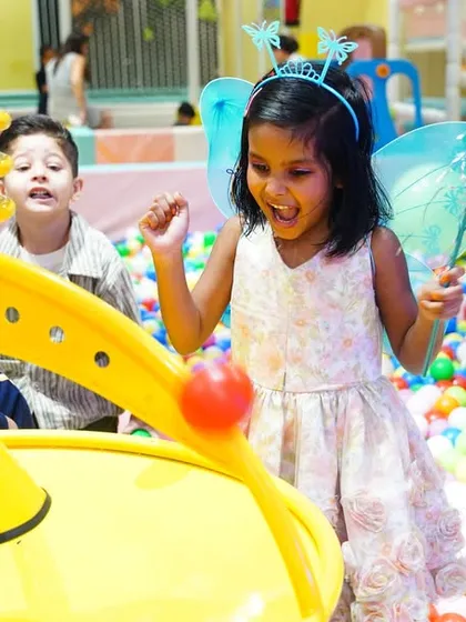 A little fairy having a blast in the ball pit, showing how our play zones are integrated into every themed party.