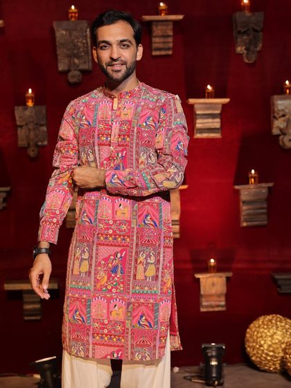 Posing before a big Navratri night. The backdrop of diyas and the traditional decor sets the perfect mood for a night of devotion and dance.