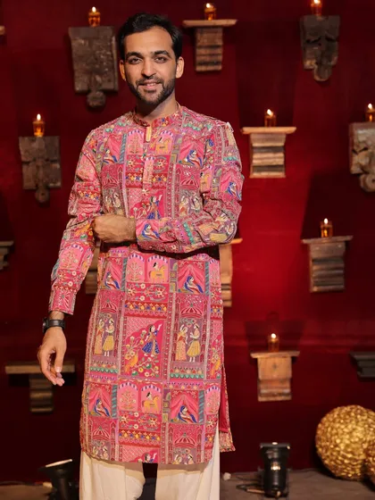 Posing before a big Navratri night. The backdrop of diyas and the traditional decor sets the perfect mood for a night of devotion and dance.