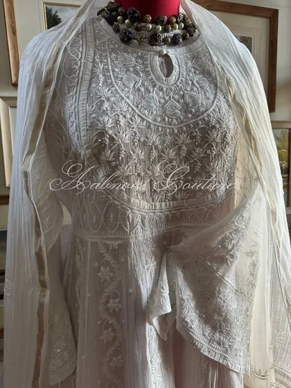 A slightly different angle, capturing the light on the delicate white-on-white embroidery.