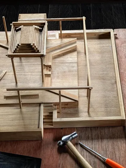 We use detailed architectural models to develop and refine our designs. This wooden model, for a structure in Bali, allows us to study the complex joinery and form before construction begins.