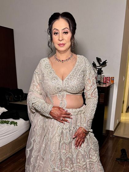 Looking so graceful on her 25th wedding anniversary. It's a joy to be part of such milestone celebrations and create looks that are both beautiful and timeless.