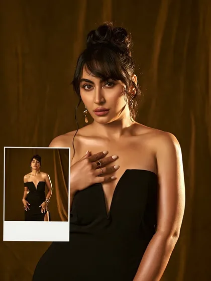 The power of a little black dress. For this shoot, we created a sophisticated look with a high bun, subtle bangs, and glowing skin to embody timeless elegance.
