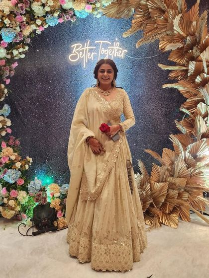 This client chose an elegant off-white, full-sleeve lehenga for her event. It’s a sophisticated and graceful look that proves you don’t always need bright colours to make a statement.