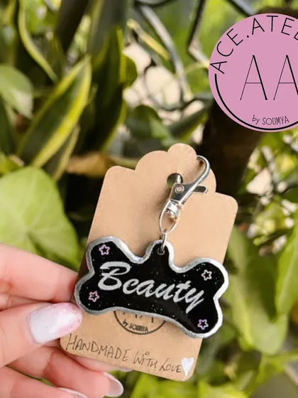 A stylish black and silver dog tag for a pet named 'Beauty'. Keep your fur babies safe and stylish with these custom tags.