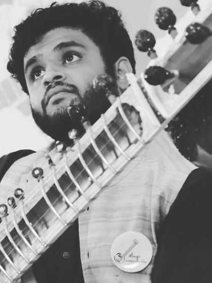 A thoughtful black and white portrait taken during the Gurupoornima event, reflecting my deep connection with the music.