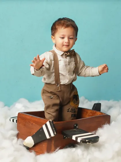 The little pilot is ready to disembark. This shot captures his movement and curiosity, a perfect end to his high-flying adventure.