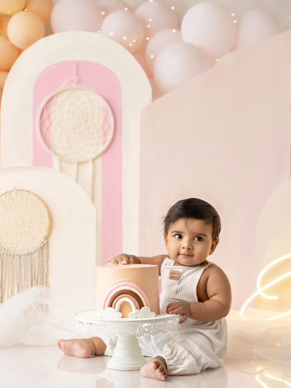 A wide view of the boho cake smash setup, showing the beautiful details of the decor.