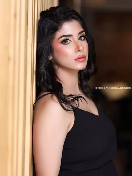 A portrait shot of the simple black dress look. The makeup is natural yet defined, suitable for both commercial and personal photoshoots.