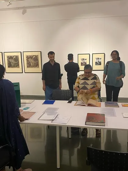 A group of women exploring the archival books.