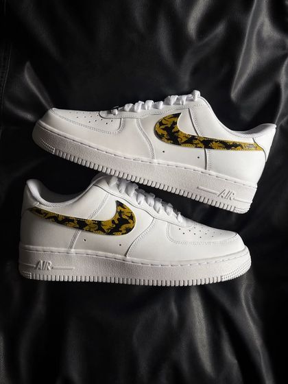 A top-down view of the leopard swoosh custom sneakers.