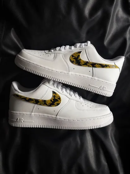 A top-down view of the leopard swoosh custom sneakers.