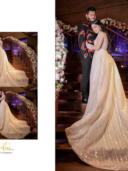A beautiful portrait of the couple on a grand staircase decorated with flowers. The bride's long train adds to the elegance of this reception photo.