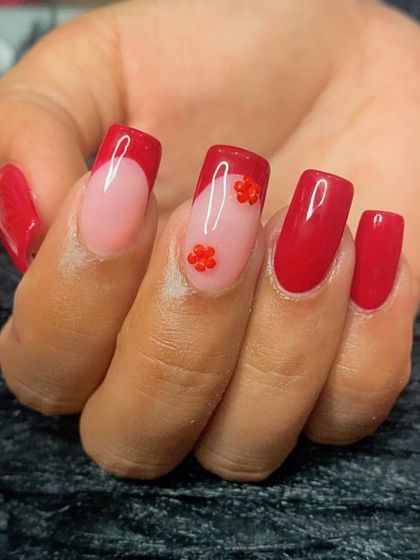 A close-up of the tiny red 3D flower charms.