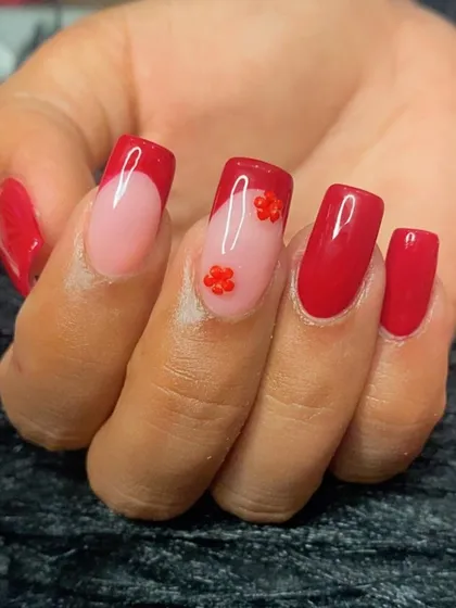 A close-up of the tiny red 3D flower charms.