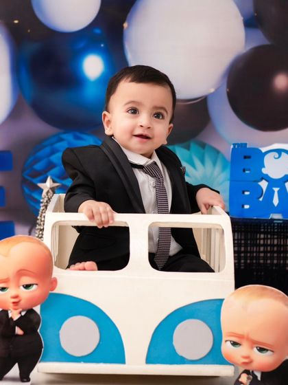 A 'Boss Baby' themed first birthday shoot. This popular theme is always a hit, creating fun and memorable photos for your little executive.