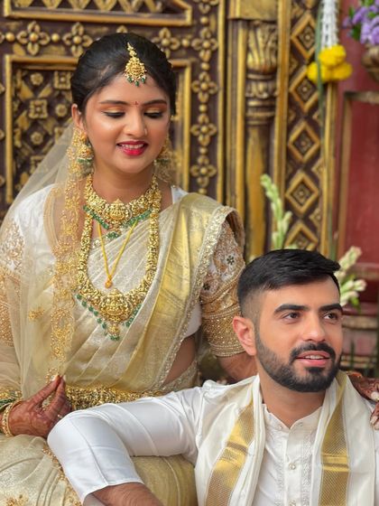 A candid moment between the happy couple. The bride's natural-looking makeup ensures she looks like herself, just more radiant.