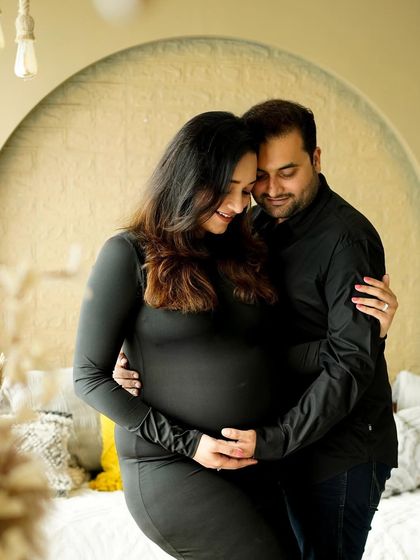 A cozy and intimate portrait of a couple in our boho studio, showing their deep connection.