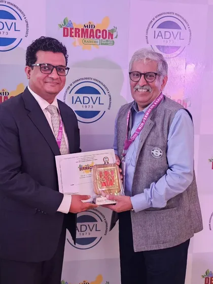 Receiving an award at Mid Dermacon 2024 after my lecture. It is always a privilege to share my knowledge with my peers.