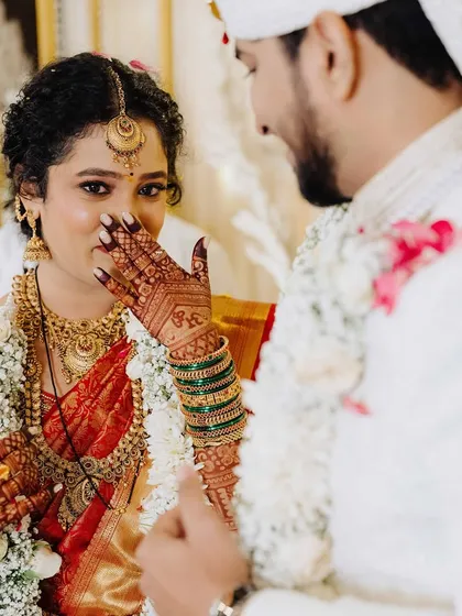 An emotional and beautiful moment. Her makeup is designed to withstand tears of joy, ensuring she looks perfect throughout the day.