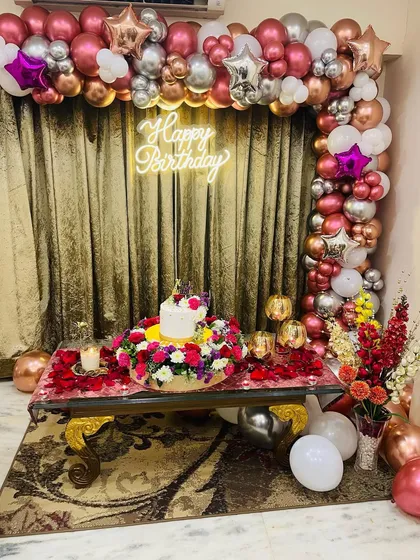 Another view of the birthday decor after the cake and other elements were added. We work with you to create a complete and cohesive look for your celebration.