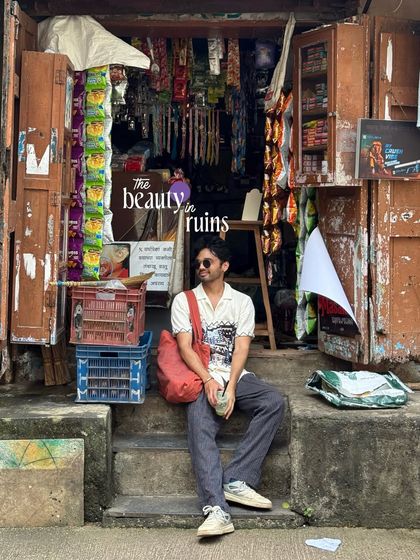 The beauty in ruins. A self-portrait sitting on the steps of a rustic old shop, finding a moment of peace in the chaos.