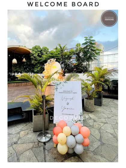 A personalized welcome board is the perfect way to greet your guests. For this outdoor engagement, I designed a simple and elegant sign that matched the modern theme of the event, complete with a small balloon accent to tie it into the main decor.