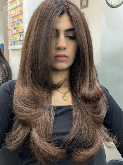 The front view of this expertly executed layered cut and blowout. It’s a timeless style that is both glamorous and easy to manage.