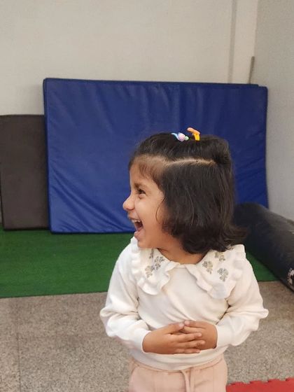 The pure, uninhibited laughter of a child having the time of her life. This is the kind of joy we strive to create in every single class.