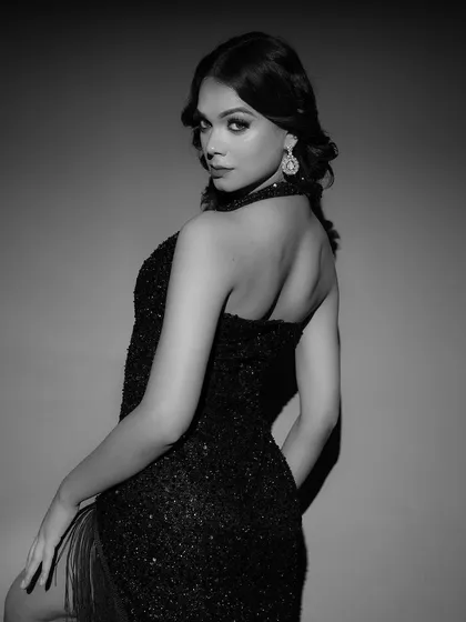Another beautiful black and white portrait from the same set, this time with the model looking back at the camera. The soft lighting and classic pose create a look of timeless Hollywood glamour.