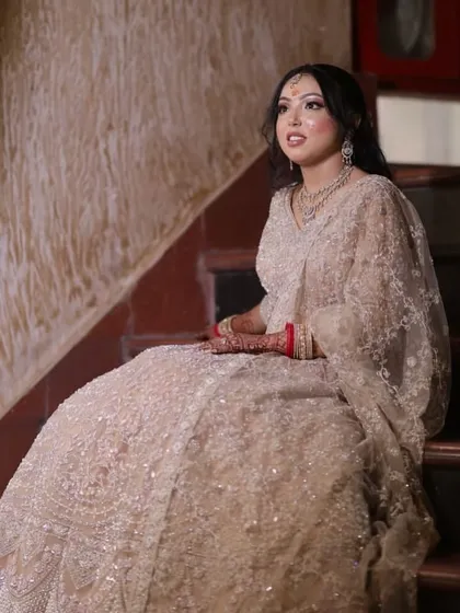 A dreamy shot of the engagement look. The soft lighting highlights the glowing skin and intricate details of her outfit.