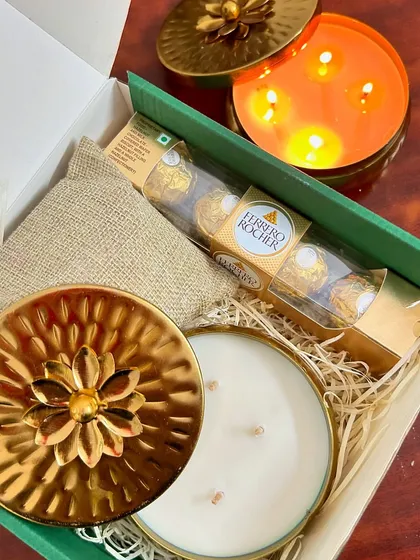 Our festive hampers are perfect for spreading joy. This popular Diwali gift box includes one of our beautiful metal urli candles, Ferrero Rocher chocolates, and premium dry fruits, all packed beautifully.