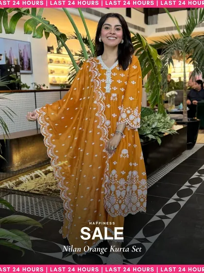My Nilan Orange Kurta Set is another festive favorite. The flowy silhouette and intricate white embroidery make it a stunning choice for special occasions.