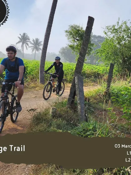 Two riders navigate a dirt trail on our 'Ridge Trail' tour, a perfect ride for those who enjoy a bit of off-road adventure.