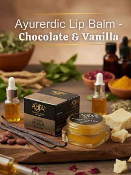 My Ayurvedic Lip Balm in Chocolate & Vanilla, shown with its natural ingredients like vanilla pods, cocoa butter, and herbal oils.